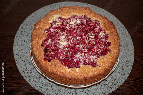 
cherry cake with oatmeal base, healthy food, berry pie for coffee or tea