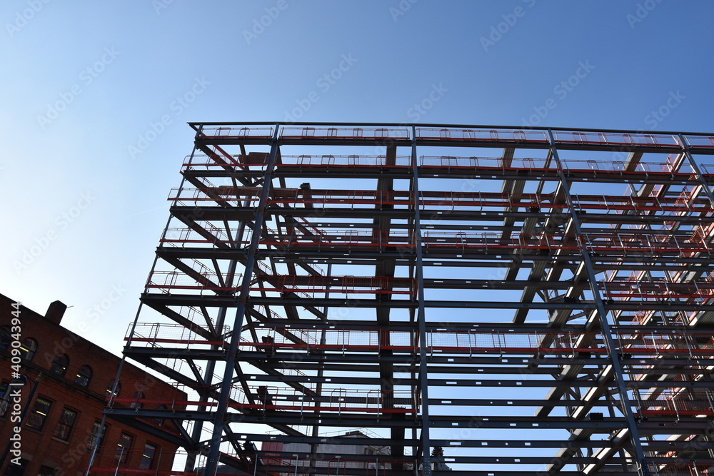 building under construction with a blue sky background. Taken in Manchester England. building under construction with a blue sky background. Taken in Manchester England.