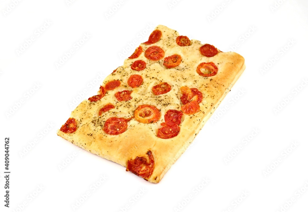 Focaccia with tomatoes and oregano on white background. It is a traditional italian baked bread similar in texture to pizza. Focaccia with tomatoes and oregano on white background. It is a traditional italian baked bread similar in texture to pizza.
