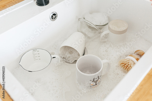 Dishes lying in white sink