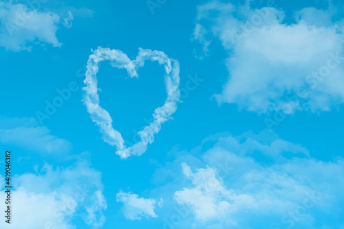Love is in the air,  with clouds and blue background.