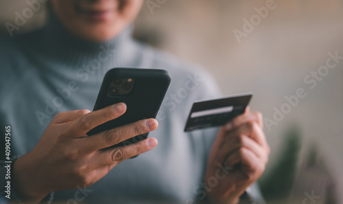 Mobile payment with wallet app technology. woman paying and shopping with smartphone application. Digital money transfer, banking and e commerce concept. photo