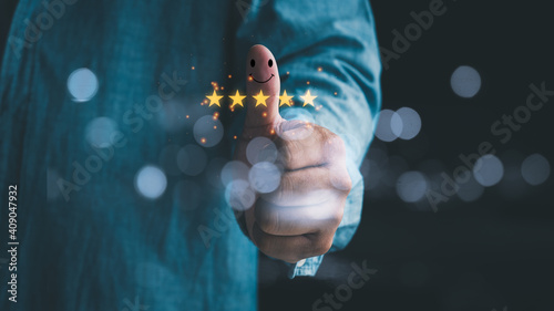 Customer service satisfaction survey concept. Business people or customers are thumbs up to show their satisfaction in service. Men give a 5 star satisfaction rating. poll or questionnaire for user. © Looker_Studio