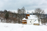 Picturesque Lopienka Orthodox Church in Bieszczady Mountains in Poland. Snowy Winter Wonderland