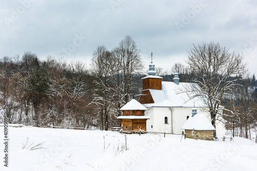 Picturesque Lopienka Orthodox Church in Bieszczady Mountains in Poland. Snowy Winter Wonderland photo