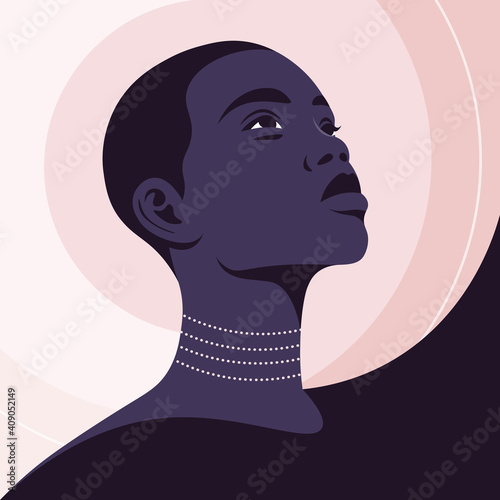 Portrait of a beautiful African woman in half-turn. Young fashion model. Avatar for social networks. Vector illustration in flat style.
