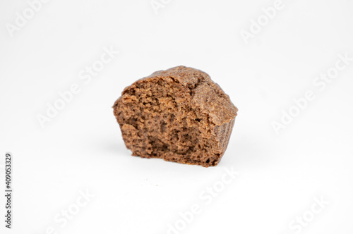 Homemade chocolate brown muffins isolated on white background