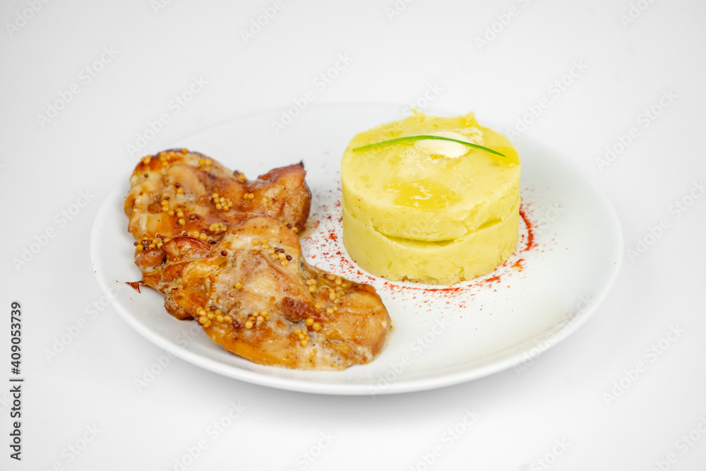 fried chicken with mustard and honey sauce with mashed potato on white background
