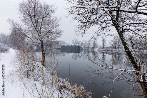 Snowy Nature with Trees around River Vltava, Holesovice, the most cool Prague District, Czech Republic