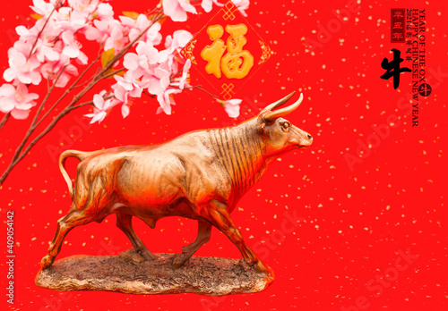 Tradition Chinese 2021 is year of the ox Chinese characters on rightside wording and seal mean Chinese calendar for the year of the ox.leftside  translation good bless for new year.