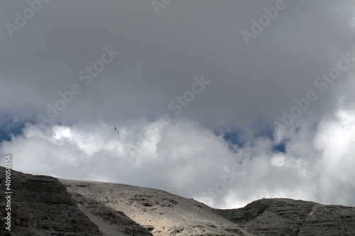 paragliding over the alps,cloud, nature,fly,air,sky, mountain, landscape,outdoors, beautiful, high,cloudy, rock,