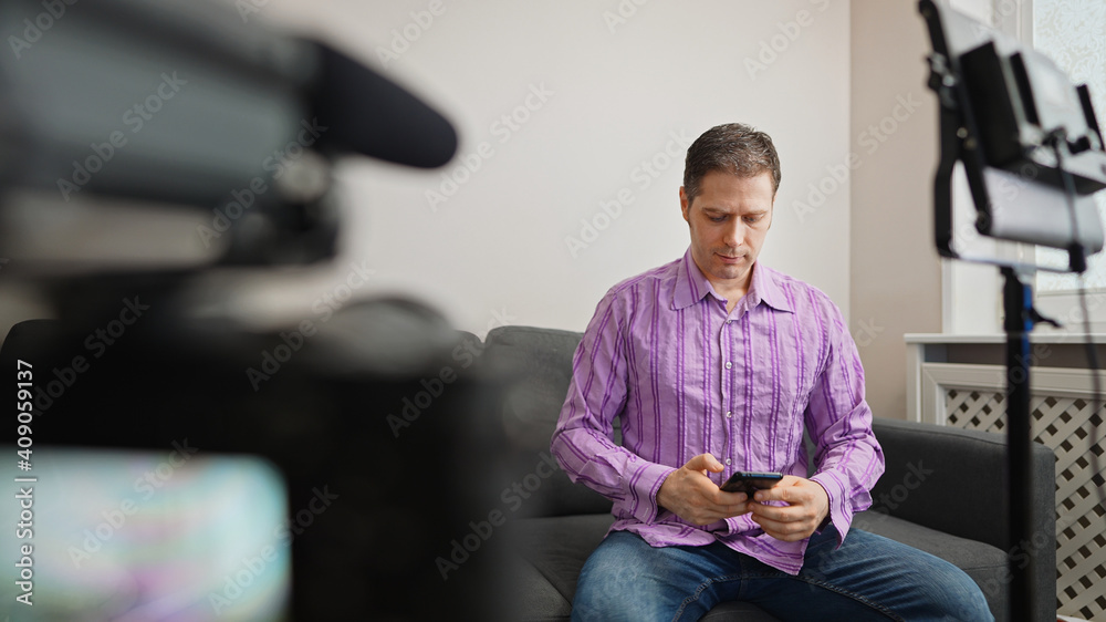 Man calling by phone from video studio. Man calling by phone from video studio.