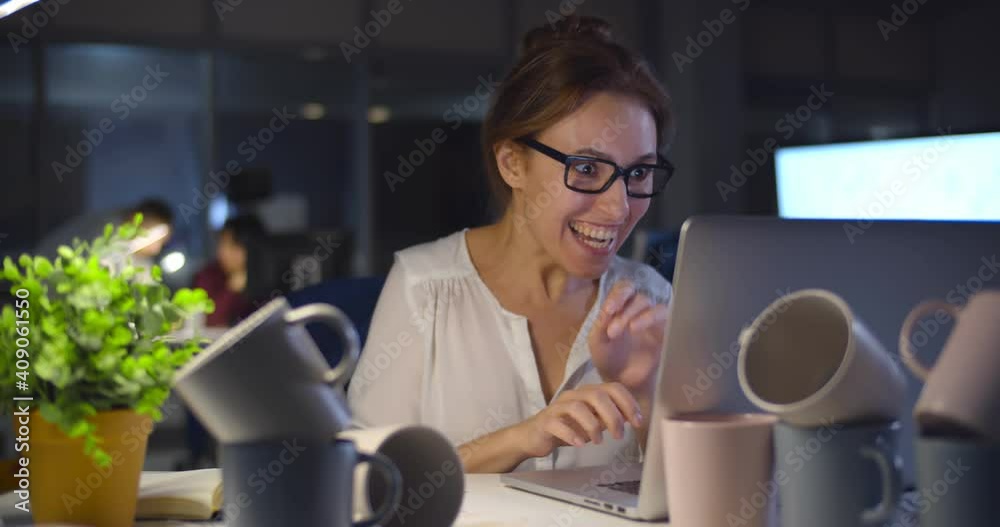 Super energetic businesswoman working late in office drinking too much caffeine