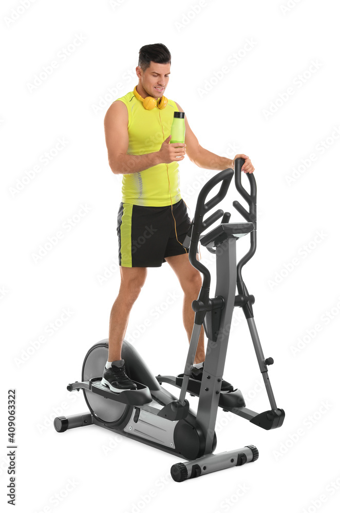 Man with bottle on modern elliptical machine against white background
