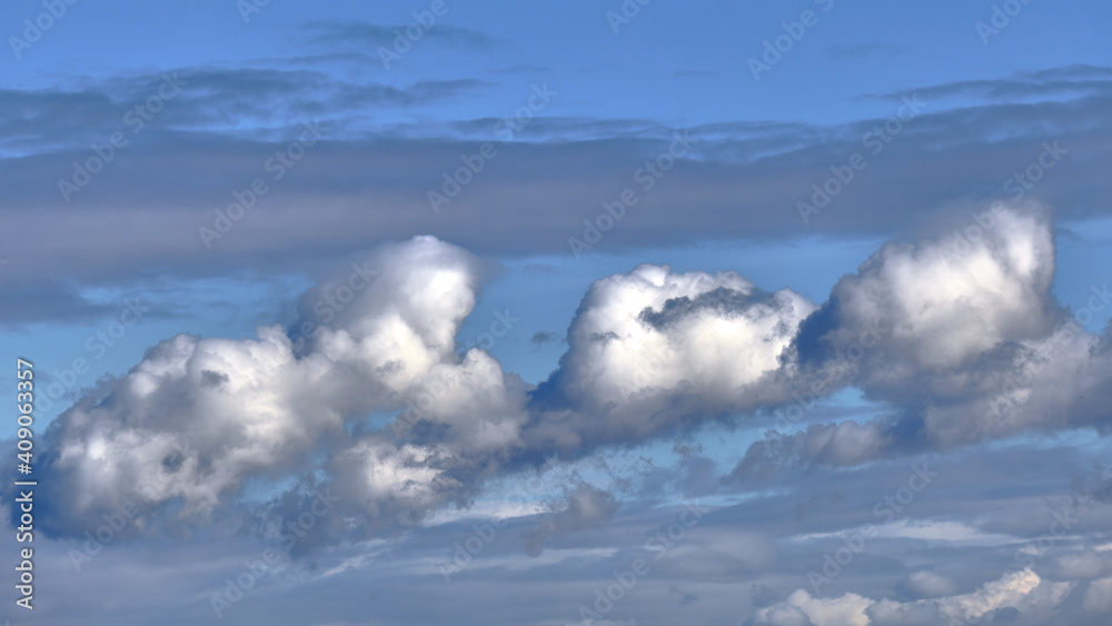 Grey and blue clouds in the sky in winter. Wind clouds Grey and blue clouds in the sky in winter. Wind clouds
