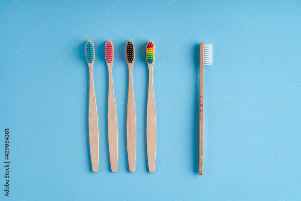 A bunch of eco-friendly bamboo toothbrushes. Global environmental trends. Gender and racial inequality. Toothbrushes of different genders A bunch of eco-friendly bamboo toothbrushes. Global environmental trends. Gender and racial inequality. Toothbrushes of different genders