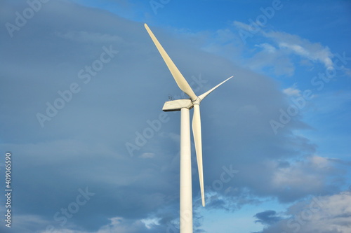 Close up of Wind turbines with blue sky background © surasak