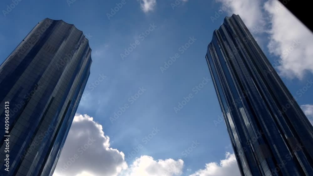 Motion Lapse (time-lapse) of modern city | Downtown Abu Dhabi landmarks, skyline and World Trade Center Towers on a cloudy day Motion Lapse (time-lapse) of modern city | Downtown Abu Dhabi landmarks, skyline and World Trade Center Towers on a cloudy day