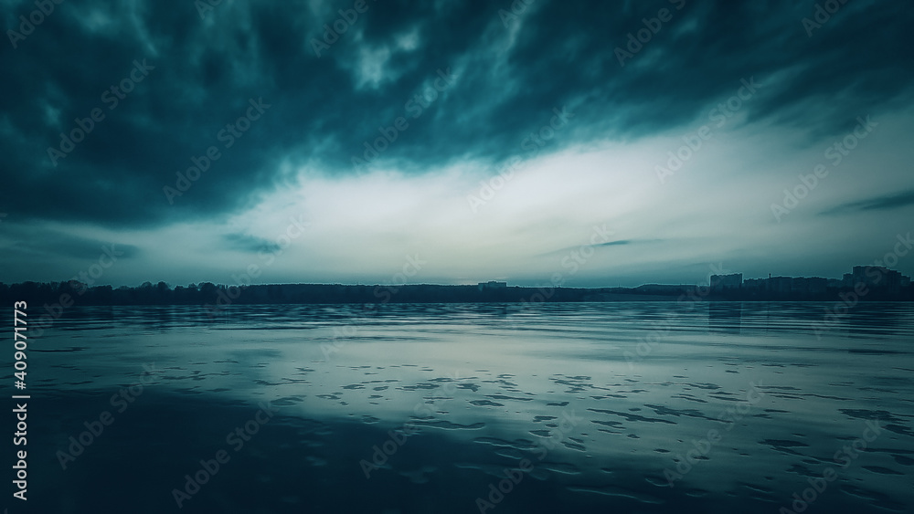 Obraz premium Sunset and clouds on the river, horror