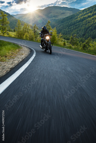Motorcycle driver riding in Alpine route in Europe. © Lukas Gojda