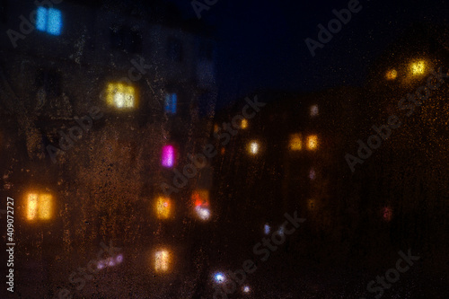 Water drops reflections on the window in night © Roberto Sorin