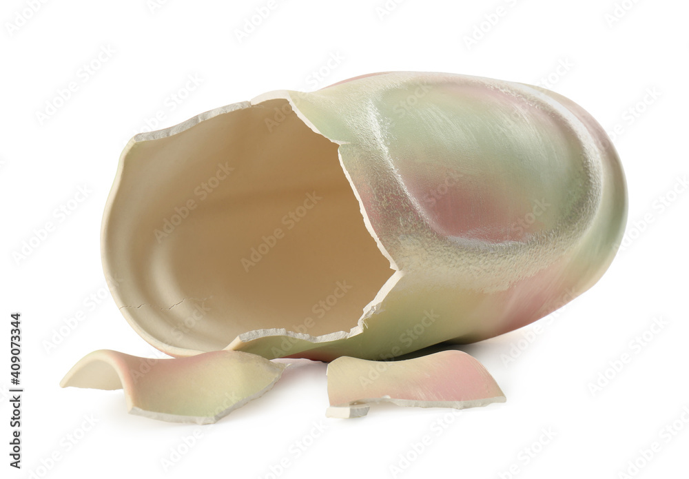Broken colorful ceramic vase isolated on white Broken colorful ceramic vase isolated on white