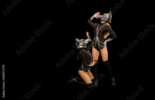 Photos Two go-go variety show dancers in wolf masks on black