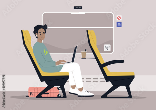 Young male commuter rides a train next to a window, modern lifestyle and travel