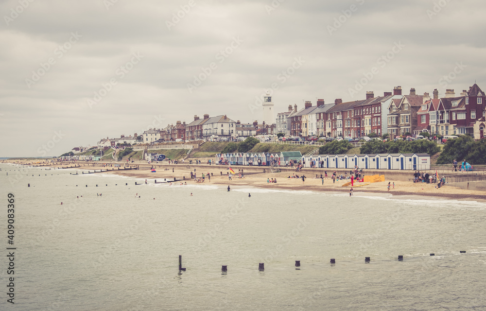 People enjoying the beach on the seafront at Southwold, Suffolk People enjoying the beach on the seafront at Southwold, Suffolk