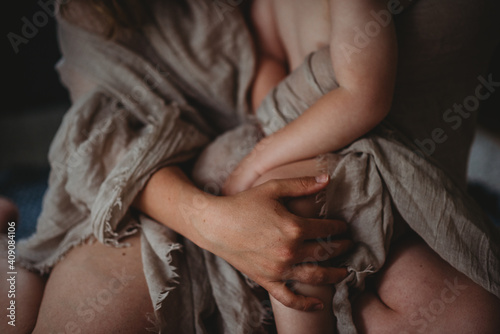 close up of hands together of mother and child photo