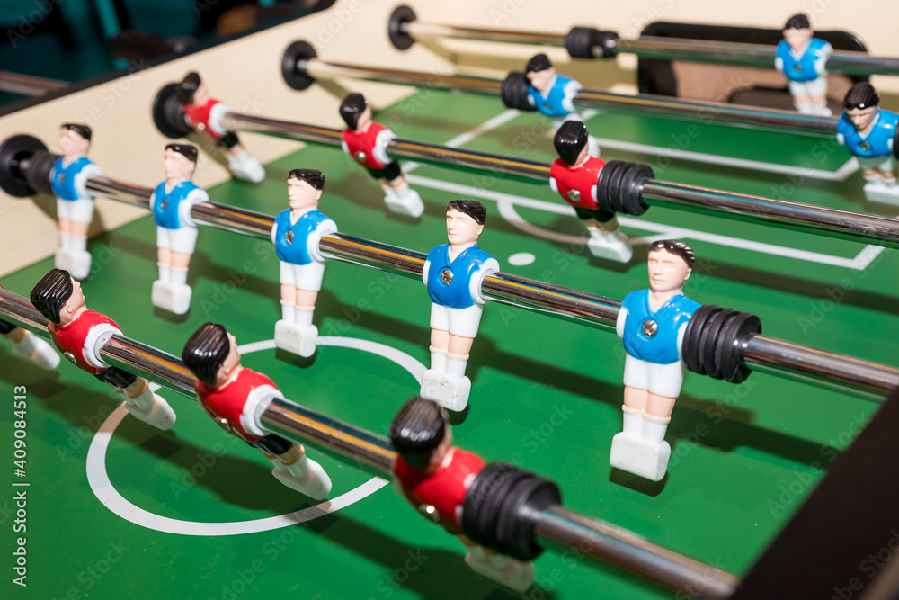 football game, Soccer table with red and blue players.dolls of a retro games.Football players miniatures from the kicker table game football game, Soccer table with red and blue players.dolls of a retro games.Football players miniatures from the kicker table game