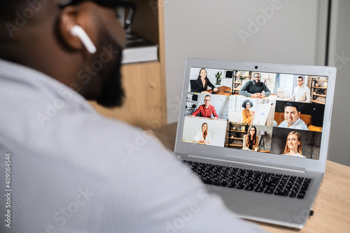Принти на полотні Close-up of African American man using app for distance video communication with