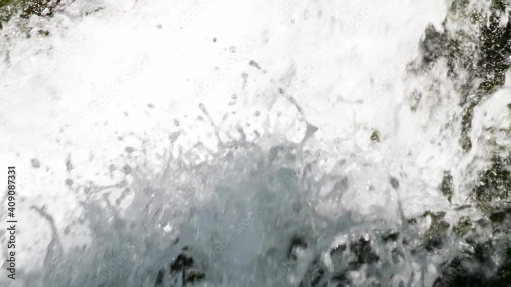 close up view of fresh water falling down from the mountains in patagonia. close up view of fresh water falling down from the mountains in patagonia.