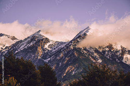 Scenic view of snowcapped mountain against cloudy sky in the Pyrenees photo