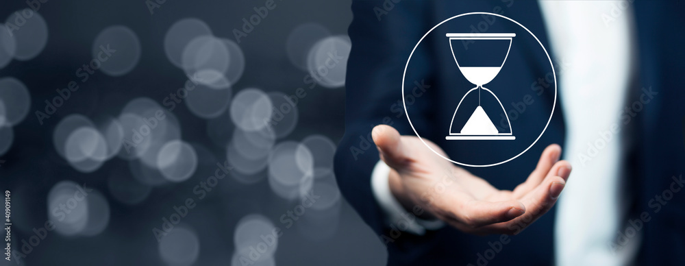 business man holding hourglass icon business man holding hourglass icon