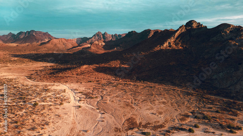 Aerial drone view of orange desert mountains at Sunset, La Paz Mexico photo