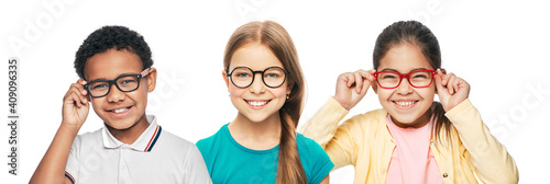 Fotografie Group of smiling multiethnic kids wearing modern eyeglasses on white background