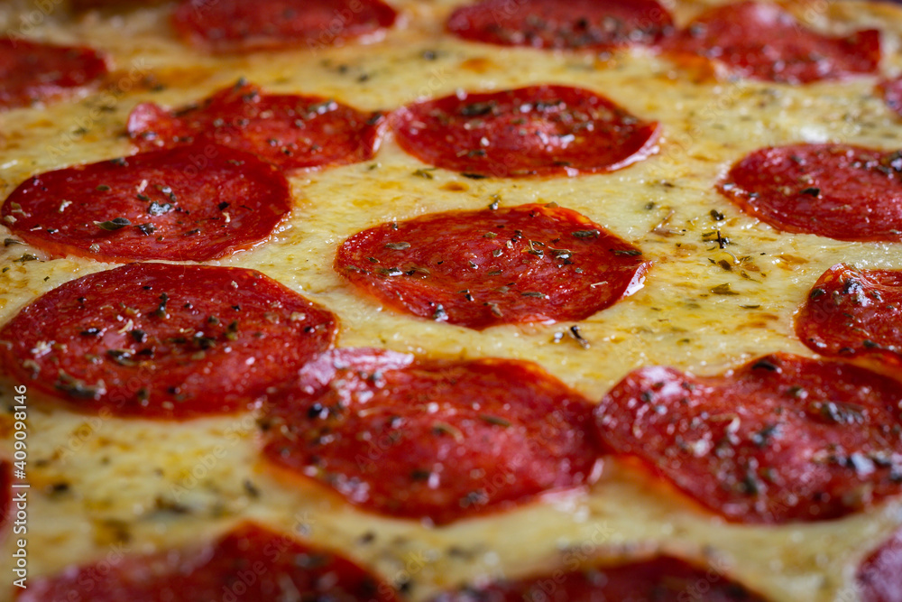 Closeup of pepperoni pizza with mozzarella cheese Closeup of pepperoni pizza with mozzarella cheese