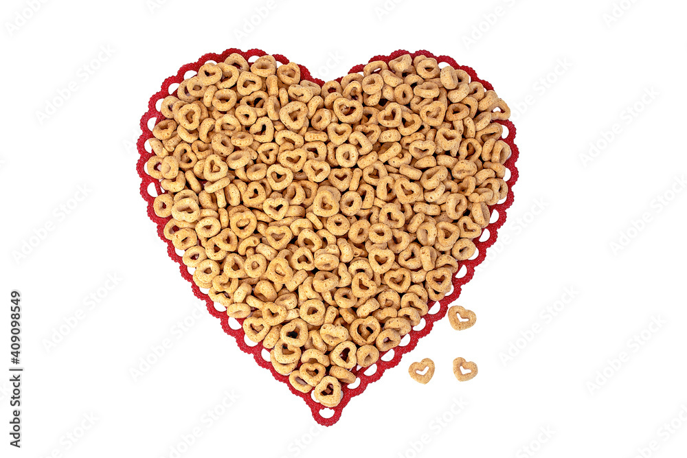 close up of breakfast cereal with circles and hearts on red lace heart doily isolated on white close up of breakfast cereal with circles and hearts on red lace heart doily isolated on white