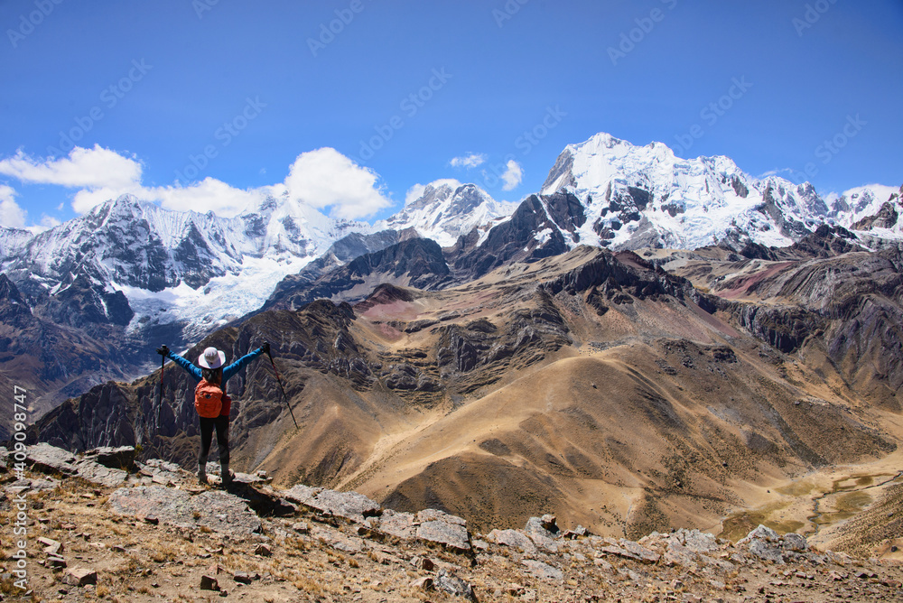 Trekker enjoying the epic views from Cerro Huacrish on the Cordillera Huayhuash circuit, Ancash, Peru