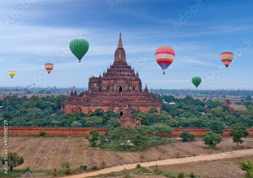 Ancient Sulamani pagoda and colorful hot air balloons flying over Bagan, Mandalay division, Myanmar