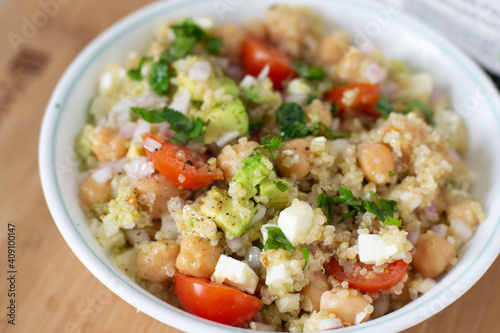 vegan food quinoa with vegetables tomato avocado and chickpeas