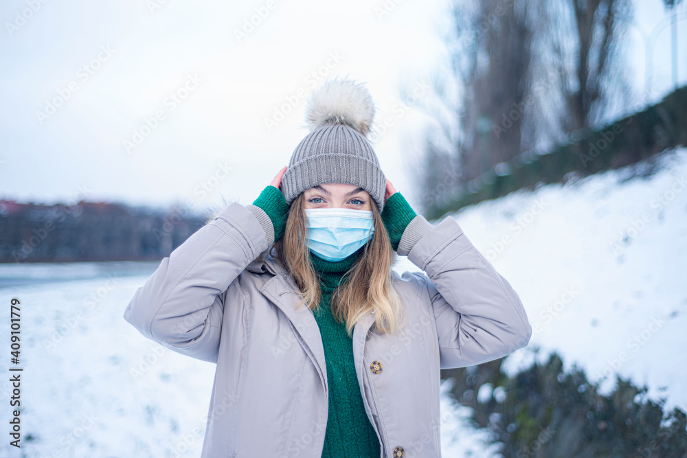 portrait of a woman in a mask in winter, a girl in a jacket and a respirator, protection against coronavirus, health care, self-isolation portrait of a woman in a mask in winter, a girl in a jacket and a respirator, protection against coronavirus, health care, self-isolation