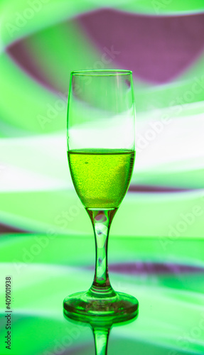 glass glass with champagne on a multicolored background