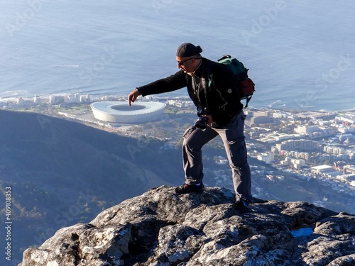 Photographer posing at Capetown Table Mountain, Capetown in the background