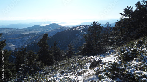 Breathtaking scenic view to whole Athens - Attica from snowed peak of Parnitha mountain, Greece photo