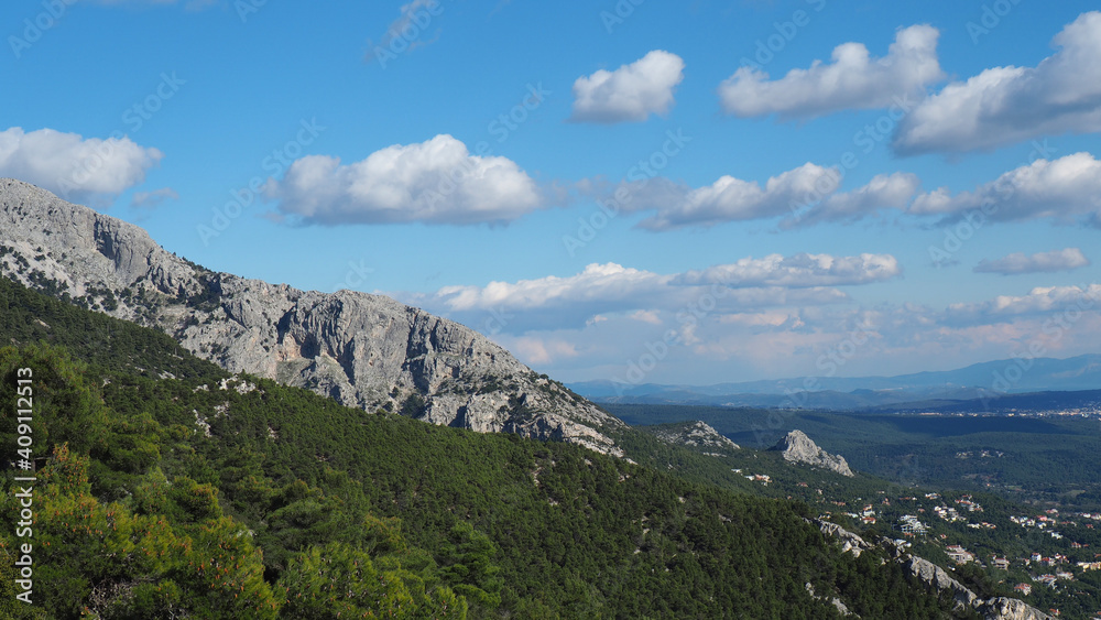 Obraz premium Beautiful mountain of Parnitha on a winter cloudy morning with clear blue sky, Attica, Greece