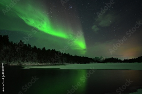 Aurora borealis over the lake in Finnmark  Norway