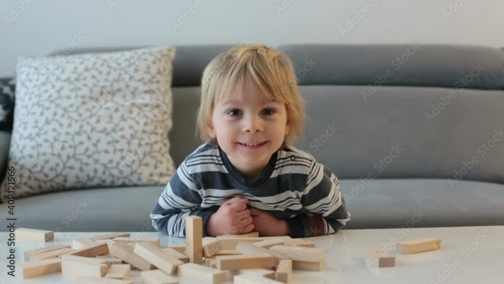 Toddler child, playing with wooden puzzle at home Toddler child, playing with wooden puzzle at home