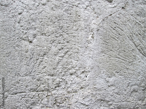 Grainy concrete texture. Building material strokes. Background with gray stone surface.
